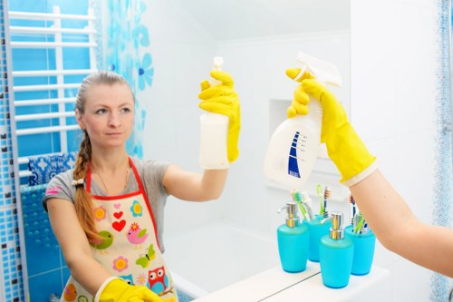 Cleaner using protective gloves and handling cleaning products safely