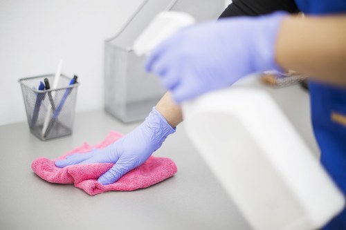 Technician cleaning a carpet affected by pet urine in Brent