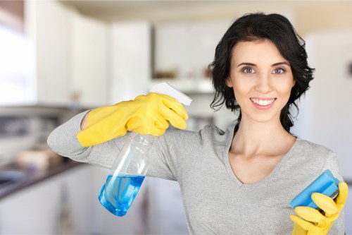 Carpet cleaning technician preparing safe equipment in a Brent property