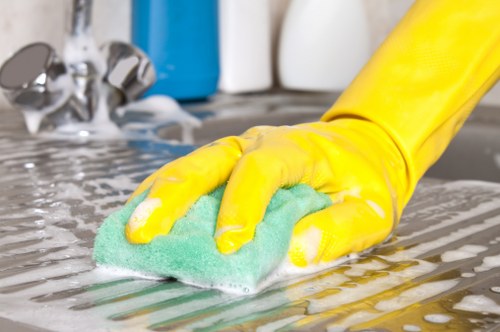 Local oven cleaner working on a range cooker in Brent